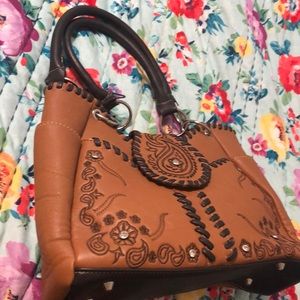 Montana West pow pow pocket purse with lots of pockets and western detail.